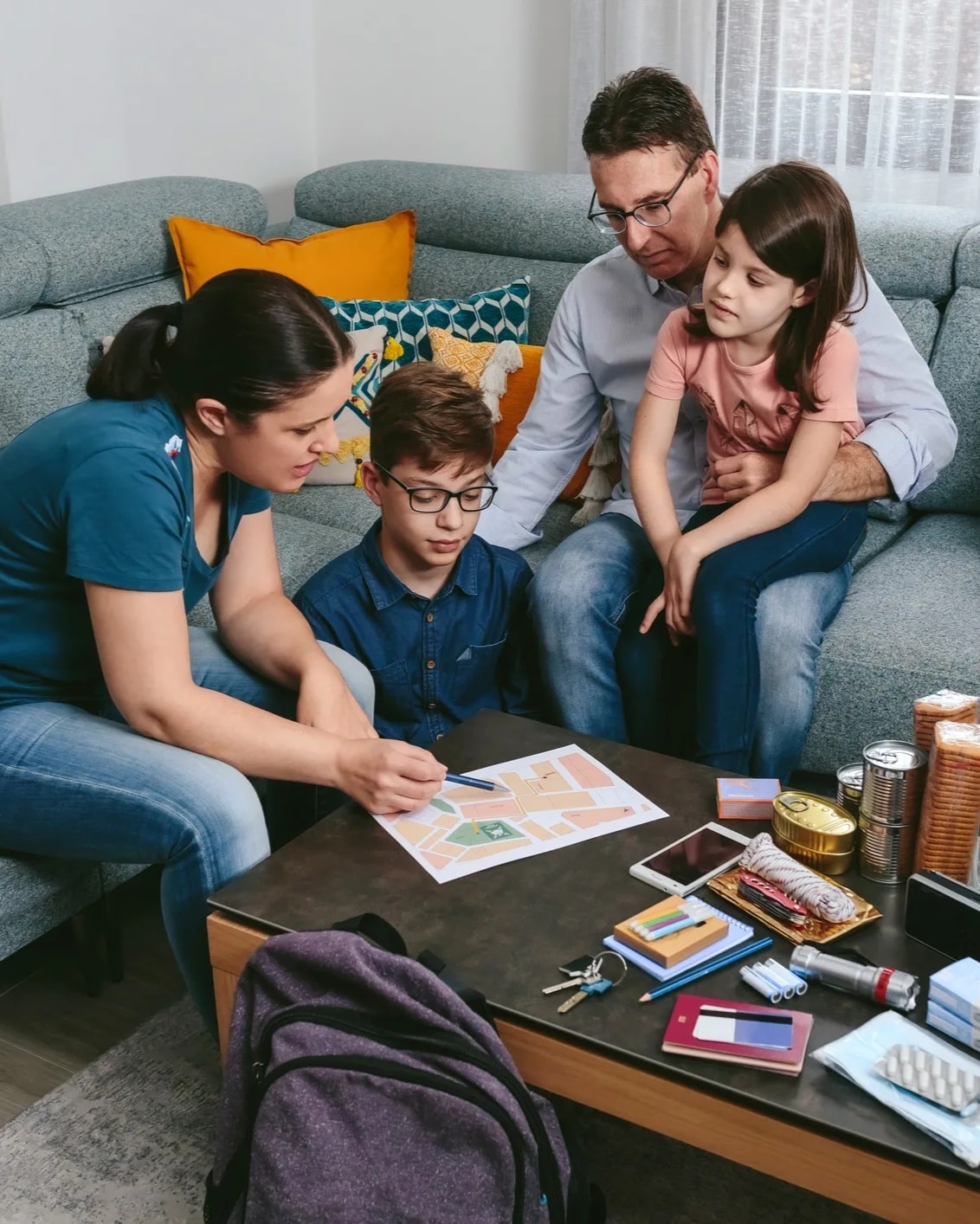 Indian family reviewing insurance documents together at home